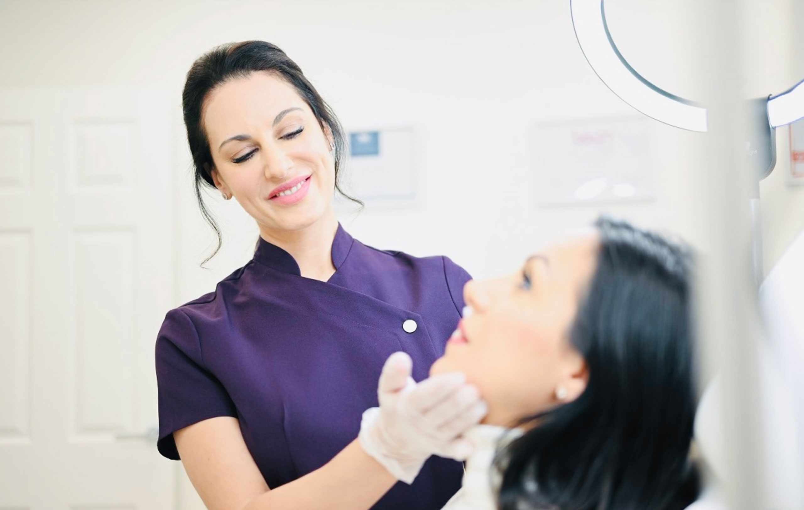 Expert nurse practitioner at Cambridge cosmetic clinic delivering skin care treatment